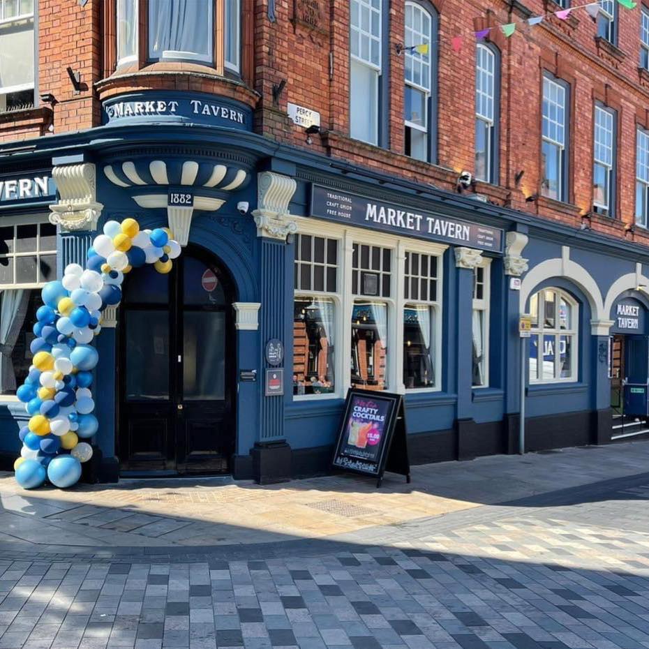 Craft Union Market Tavern exterior dressed with launch balloons