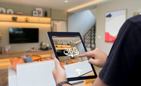A person exploring a U-See Homes virtual property tour on a tablet